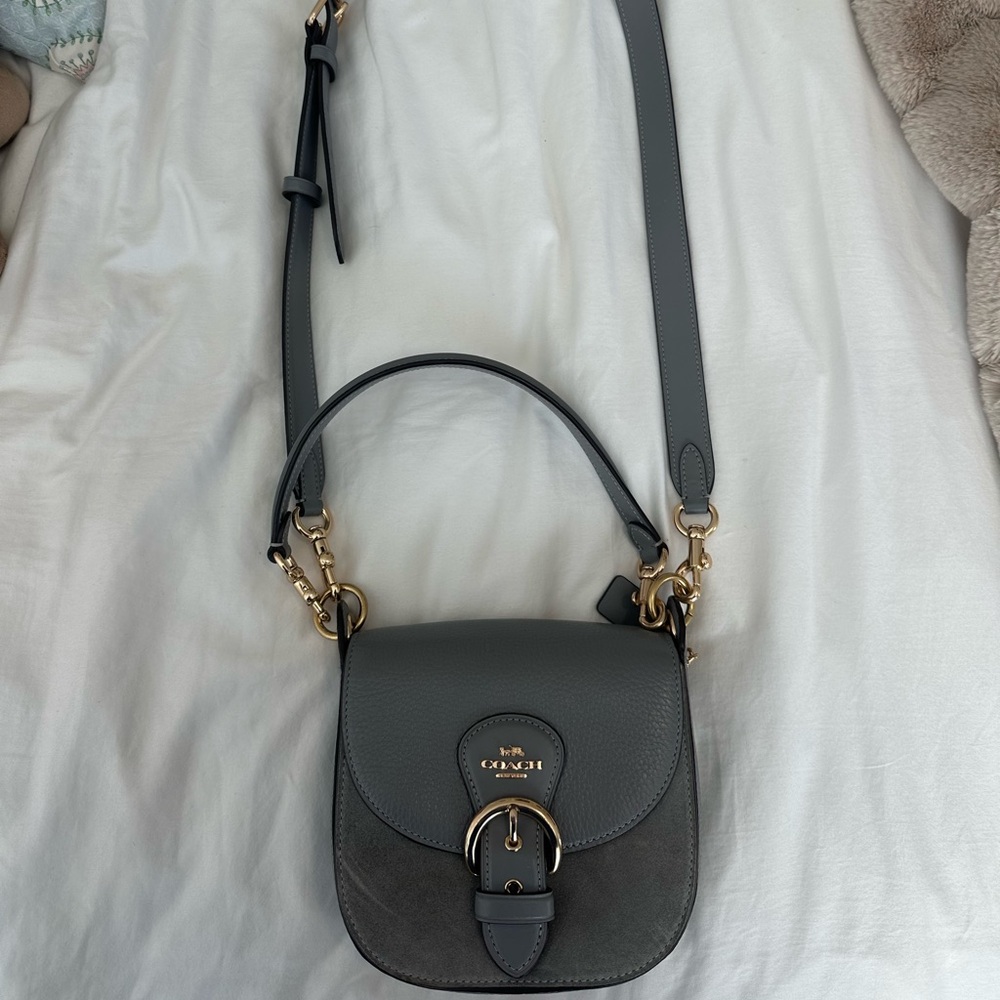 Dark gray coach crossbody with gold hardware